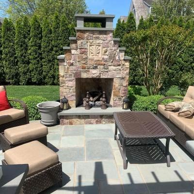 Outdoor fireplace installation on patio deck.