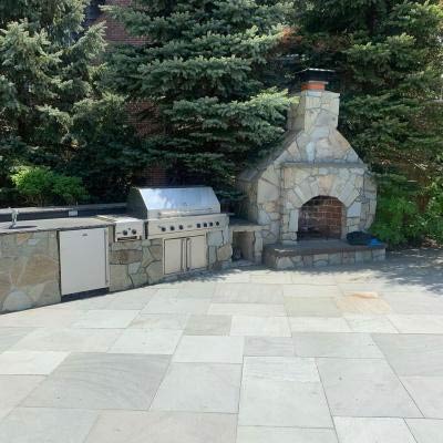 Outdoor fireplace and bbq grill installation from Alpine Fireplaces.